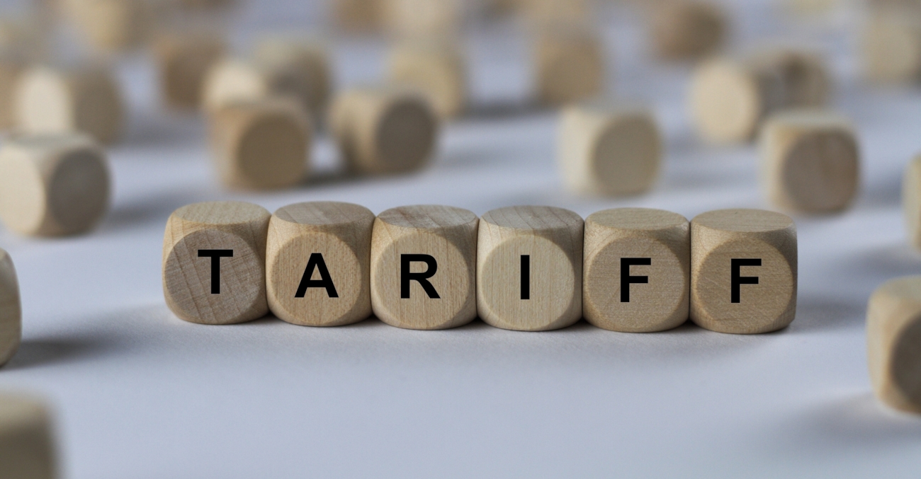 Illustrasjon av terninger som staver Tariff